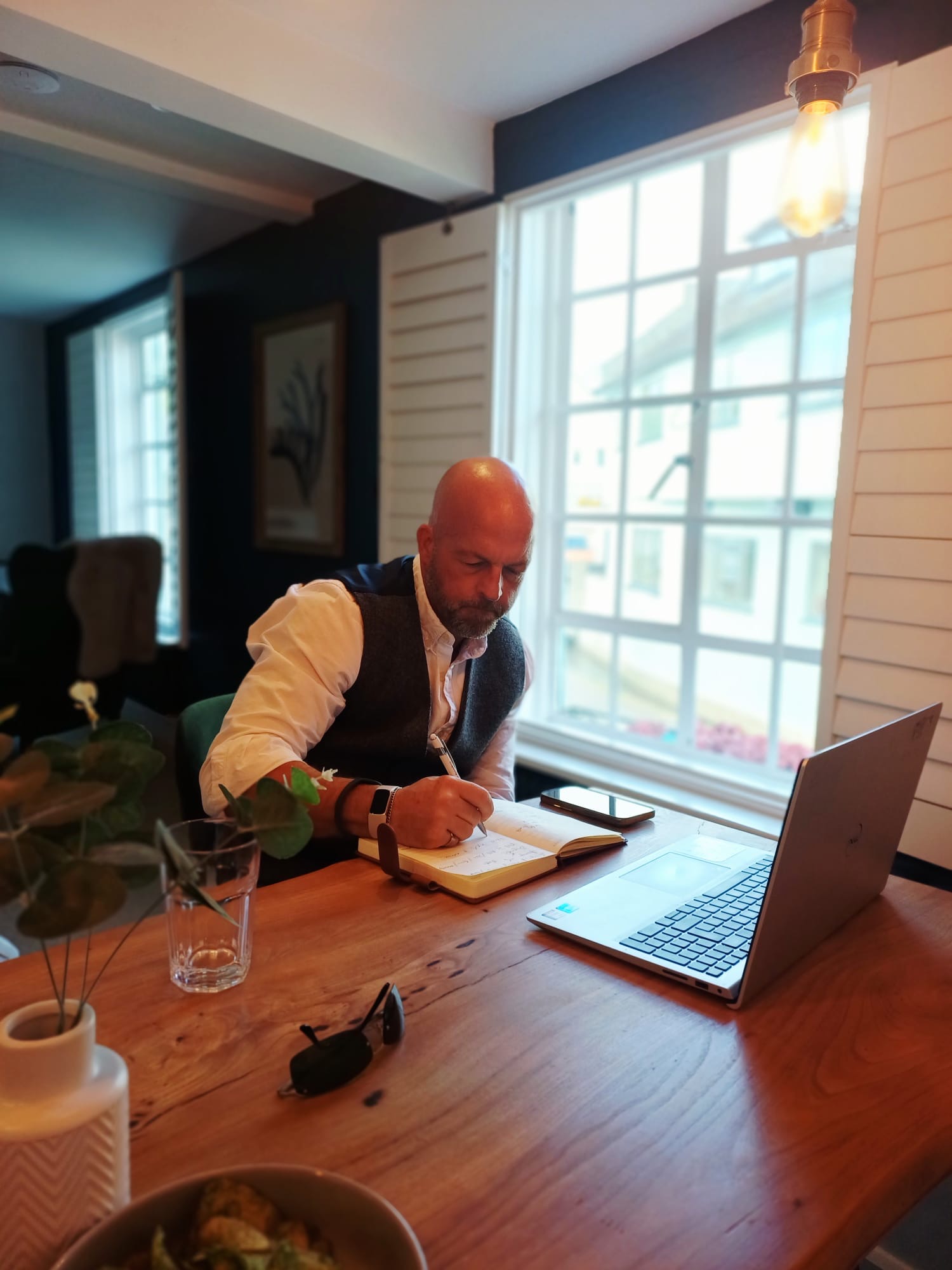 Alex Sullivan working at his desk